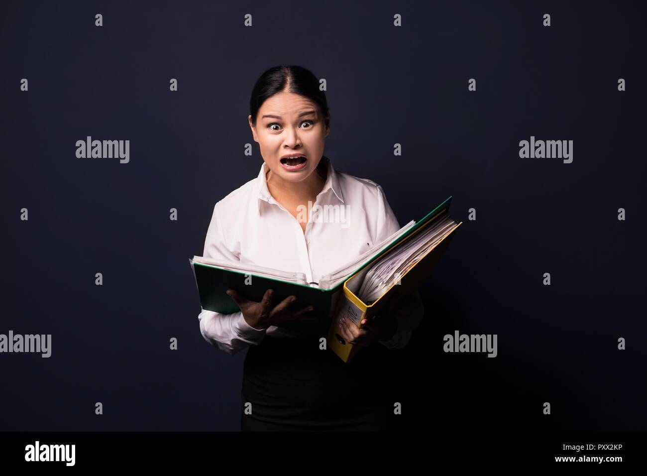 Portrait of young happy smiling business woman with folder Stock Photo ...
