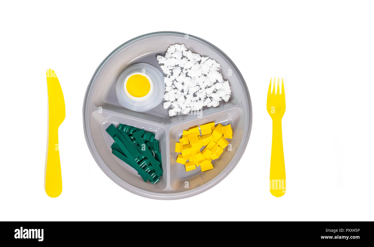 A plate of food made of plastic. Concept showing awareness of the dangers of not knowing what is contained in our food. Stock Photo