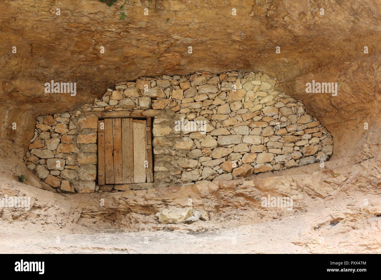 A shelter for shepherds and livestock made of stone drywall inside a ...