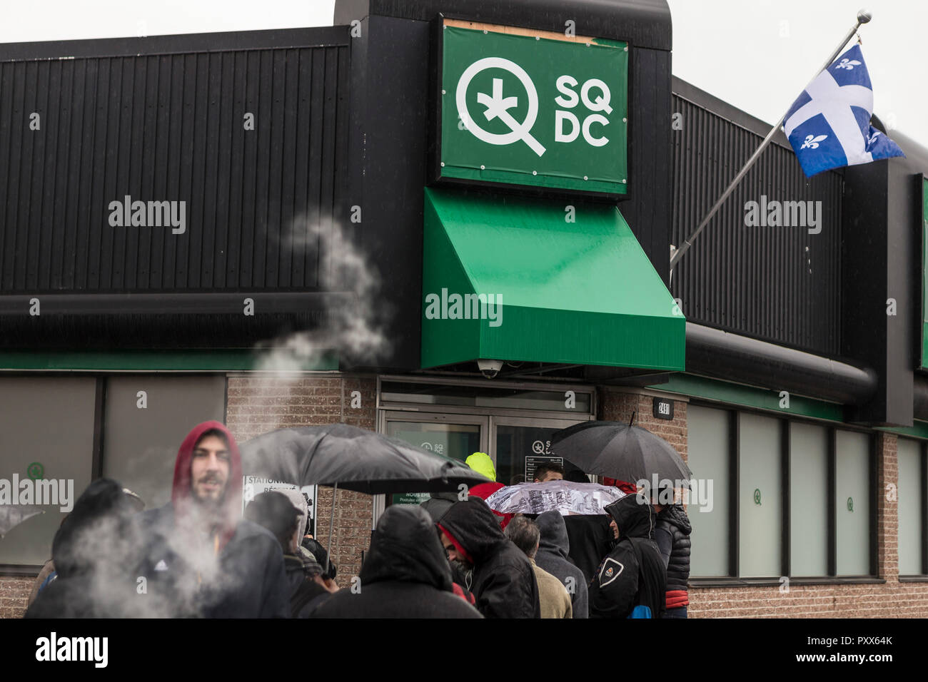 A line of customers formed on the first day of cannabis legalization at a SQDC (Societe quebecoise du cannabis) store in Quebec city, Canada, 17 October 2018. Stock Photo