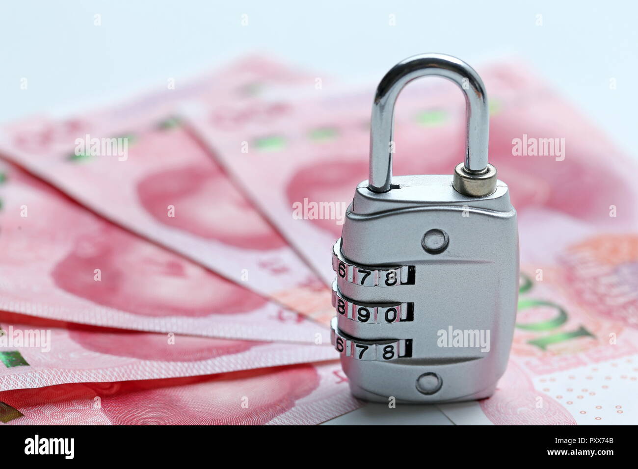 Financial security concept Password lock and banknotes on white ...