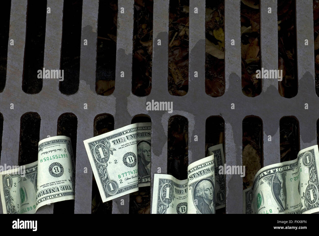 Throw money down the drain hires stock photography and images Alamy