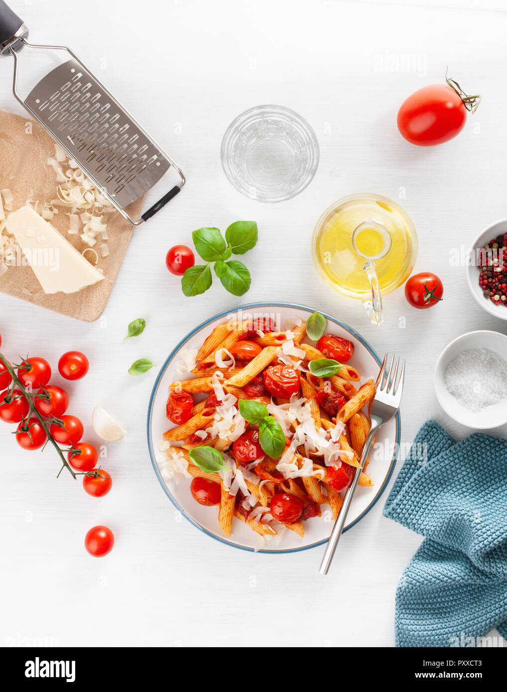 italian penne pasta with tomatoes parmesan basil Stock Photo - Alamy