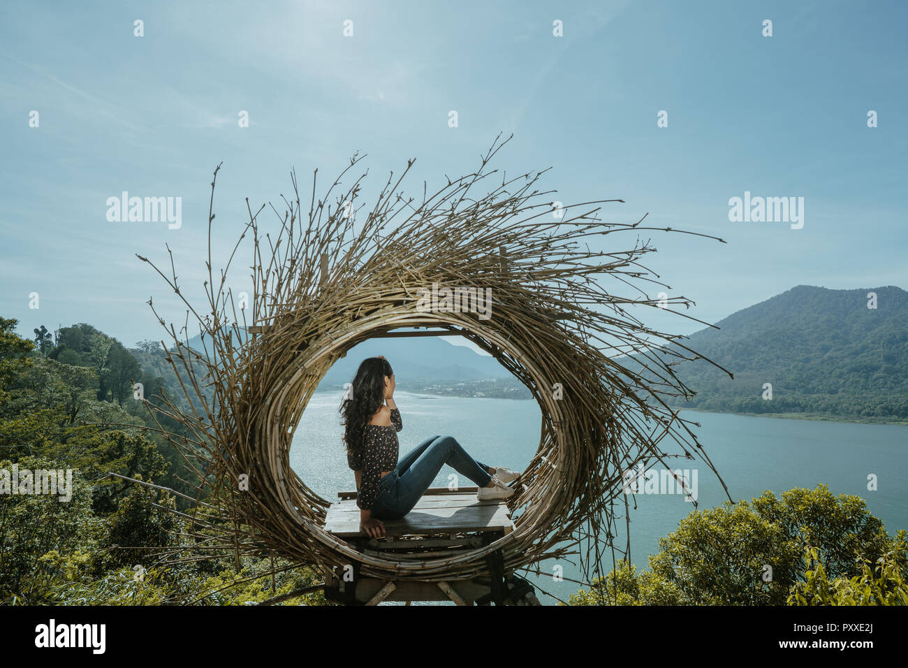 woman portrait enjoying nature from a hill top Stock Photo