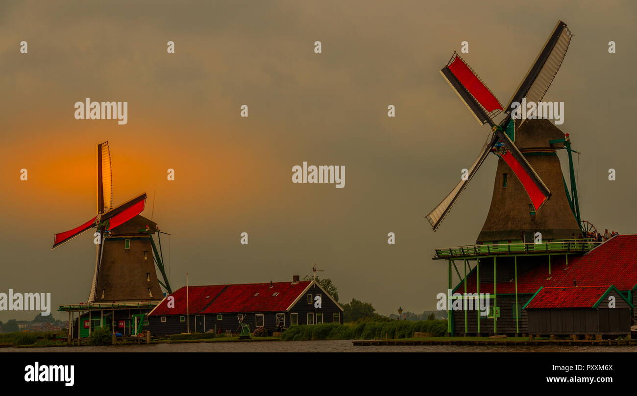 Zaamdam, Netherlands - the windmills of the Zaanse Shans historic neighborhood in the this Dutch village near Amsterdam image in landscape format Stock Photo
