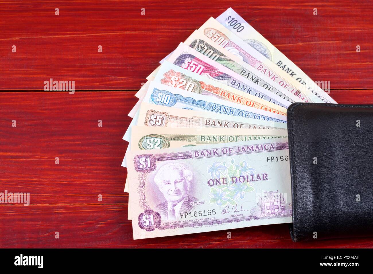 Jamaican money in the black wallet Stock Photo