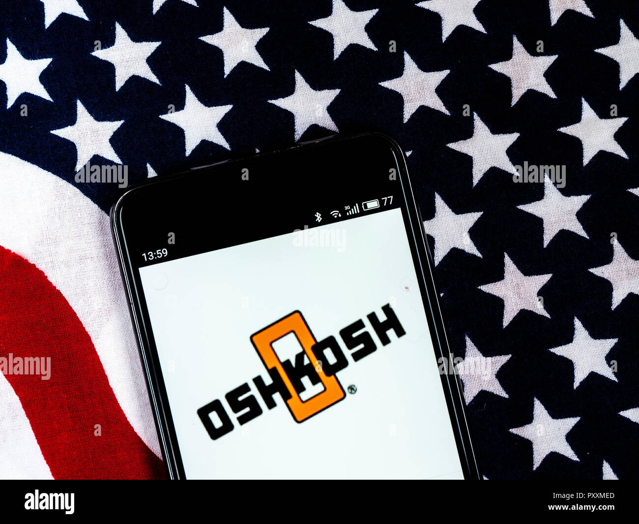 Oshkosh Corporation Defense industry company logo seen displayed on smart phone. Oshkosh Corporation, formerly Oshkosh Truck, is an American industrial company that designs and builds specialty trucks, military vehicles, truck bodies, airport fire apparatus and access equipment. Stock Photo