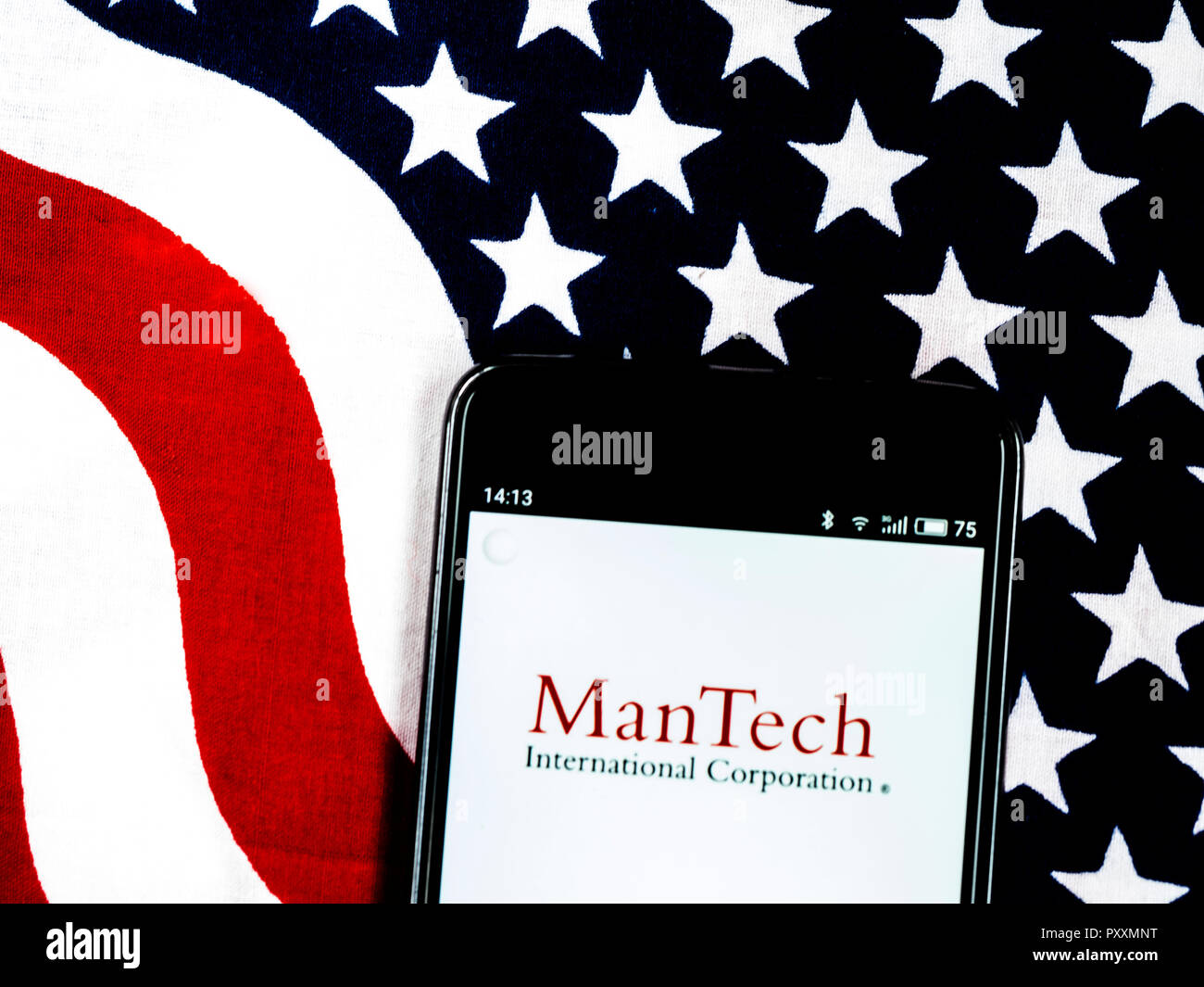 ManTech International logo seen displayed on smart phone. ManTech International Corporation uses advanced technology to help government and industry manage and protect information, support and maintain critical systems, and develop integrated systems to handle complex needs. Stock Photo