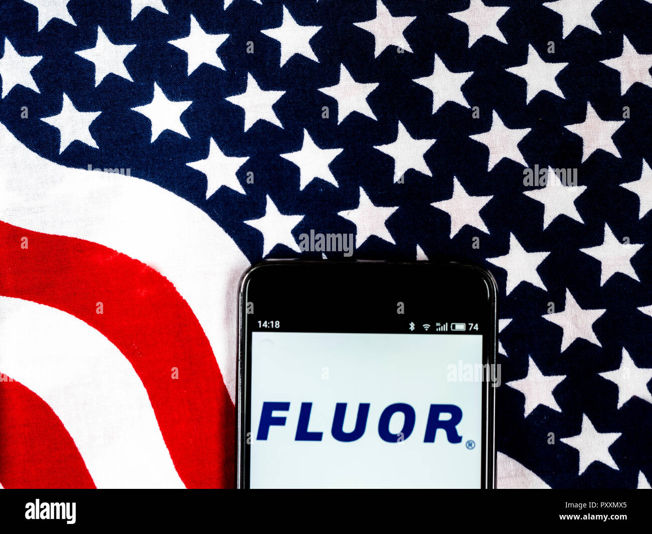 Fluor Corporation Engineering company logo seen displayed on smart phone. Fluor Corporation is a multinational engineering and construction firm headquartered in Irving, Texas. It is a holding company that provides services through its subsidiaries in the following areas: oil and gas, industrial and infrastructure, government and power. Stock Photo