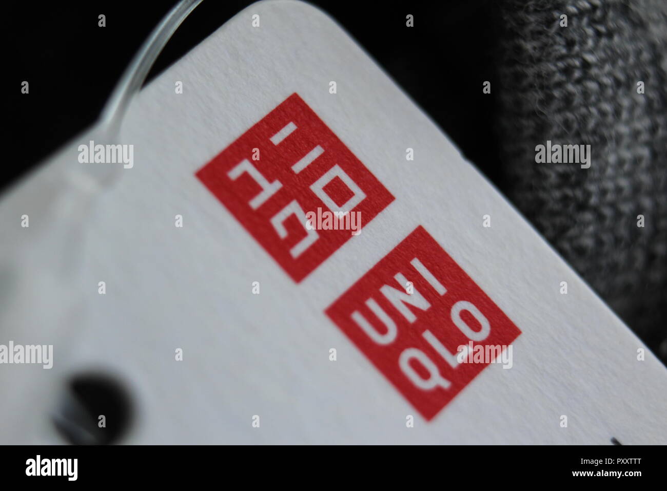 Detail of label with logo on clothes by Japanese retailer Uniqlo Stock  Photo - Alamy