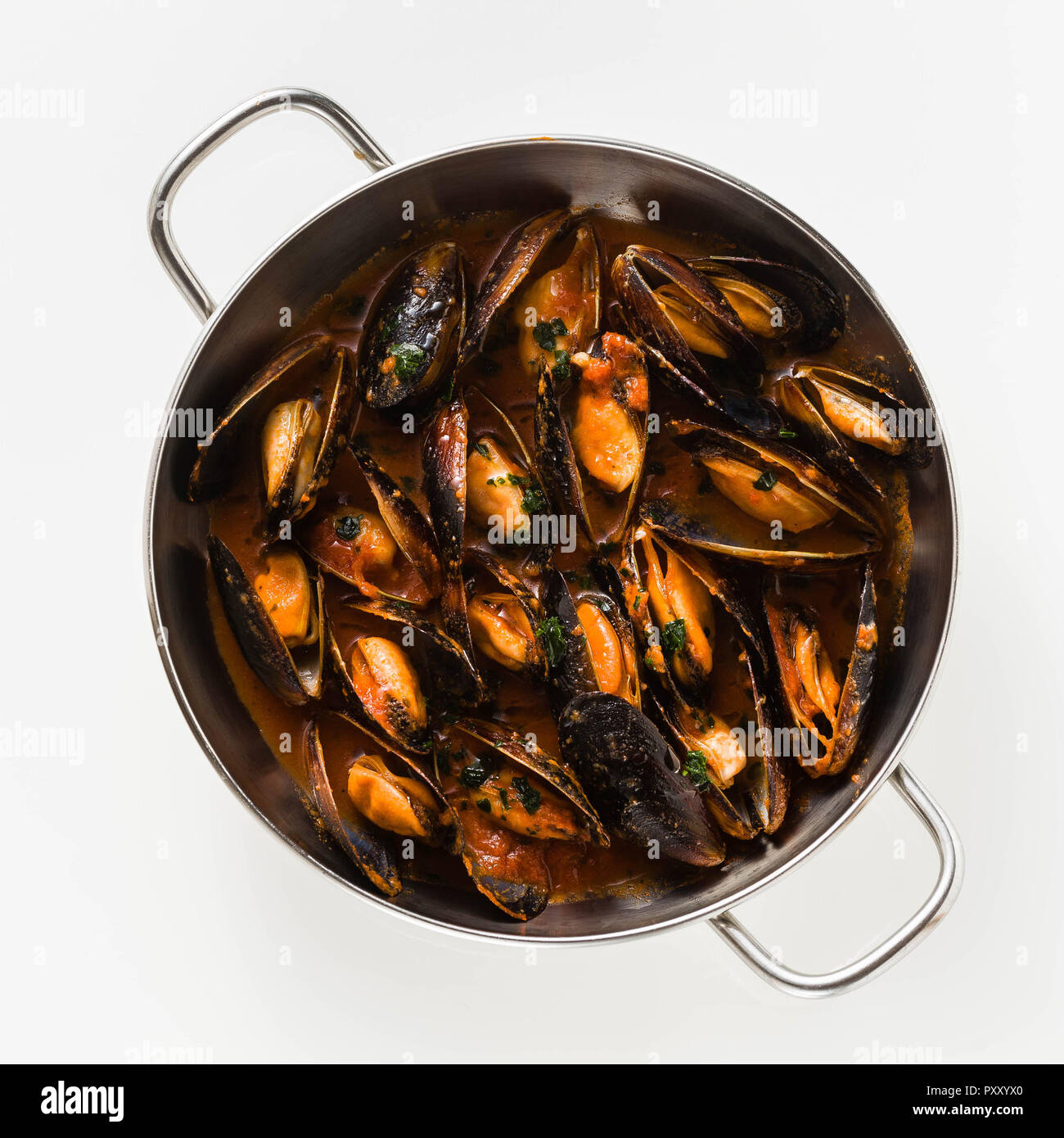 freshly cooked mussels in a frying pan in tomato sauce. pepata di cozze