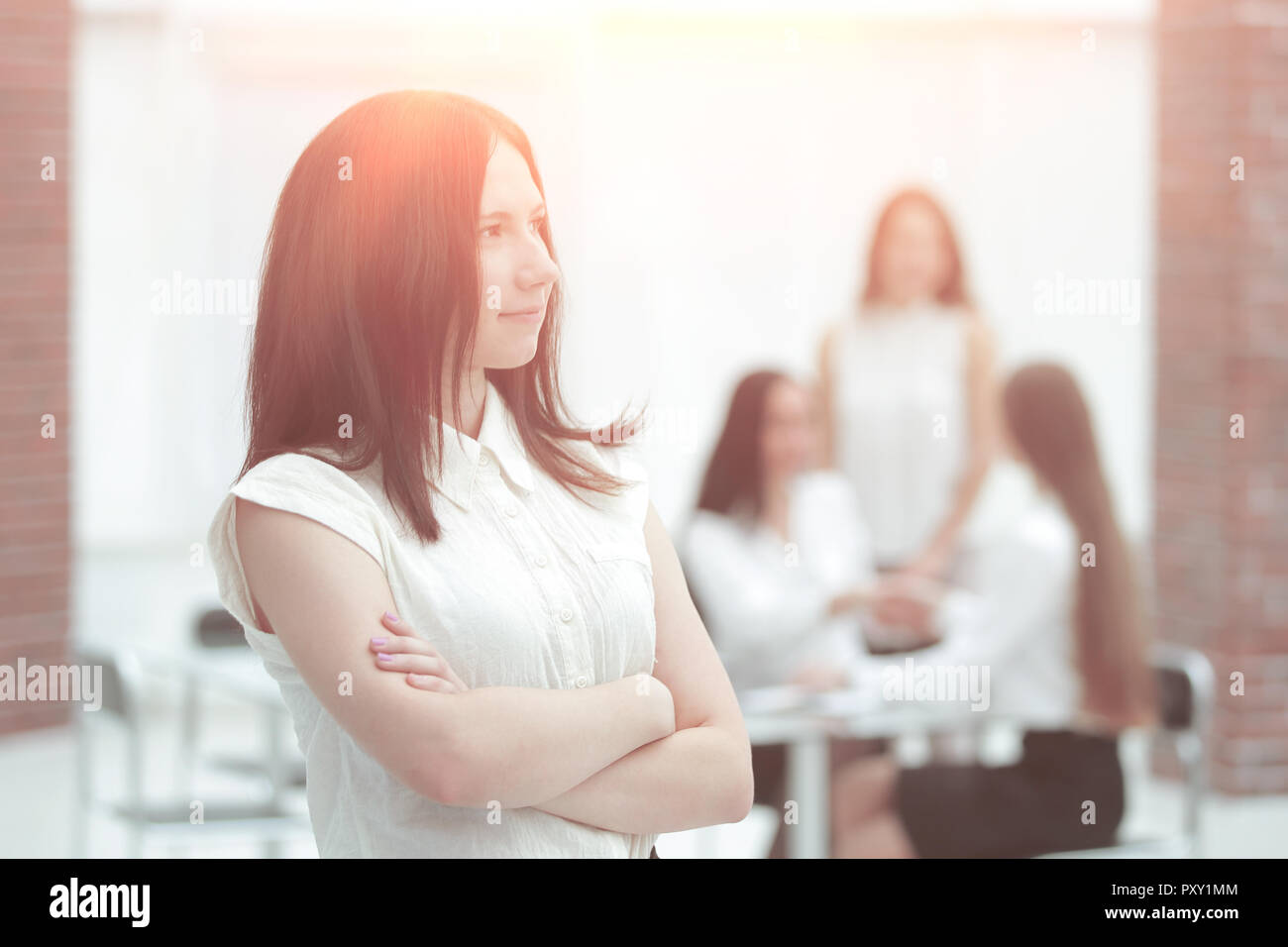 portrait of confident young business woman on office background Stock ...