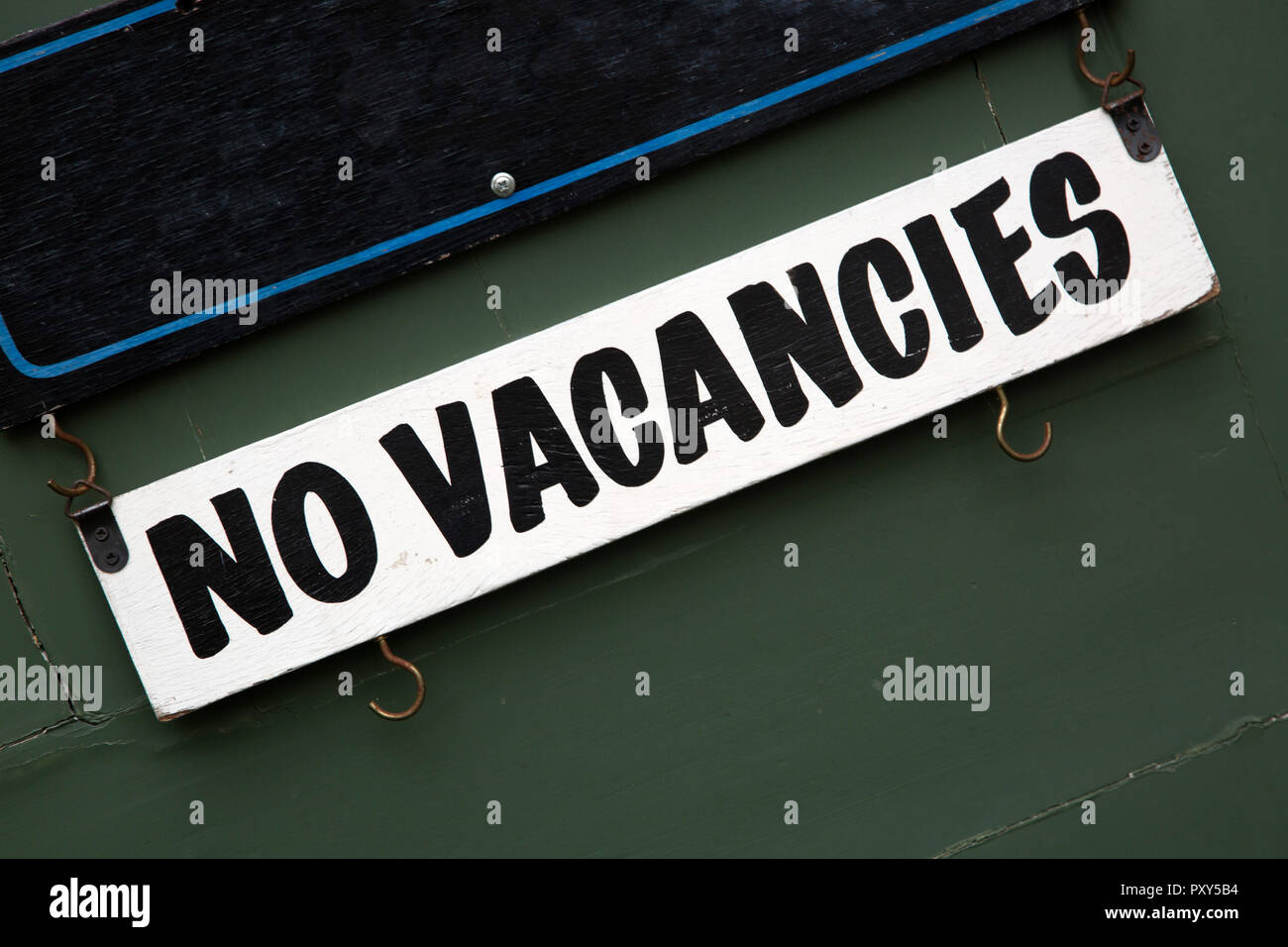 Hotel No Vacancies Sign on Door Stock Photo