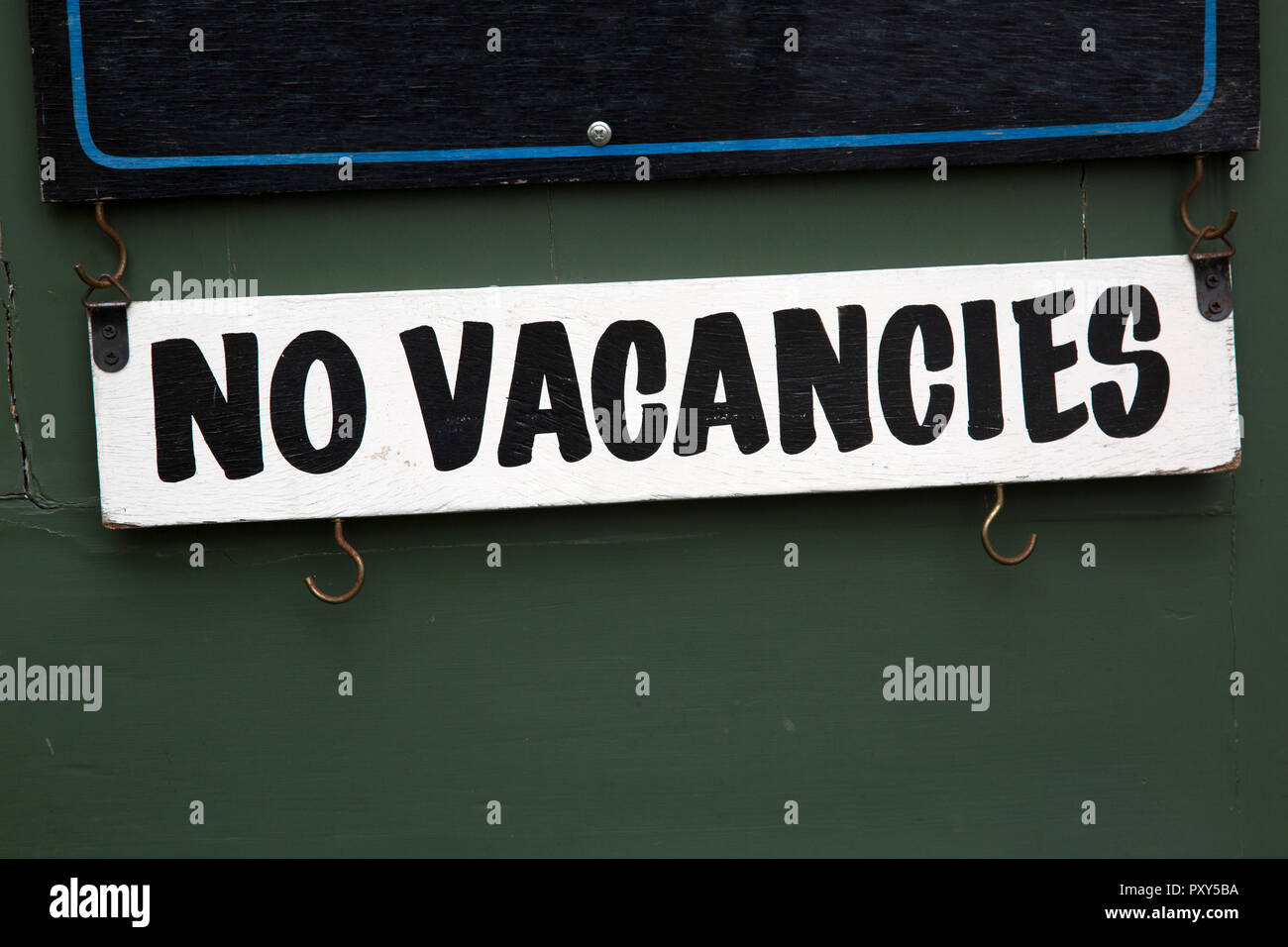 Hotel No Vacancies Sign on Door Stock Photo