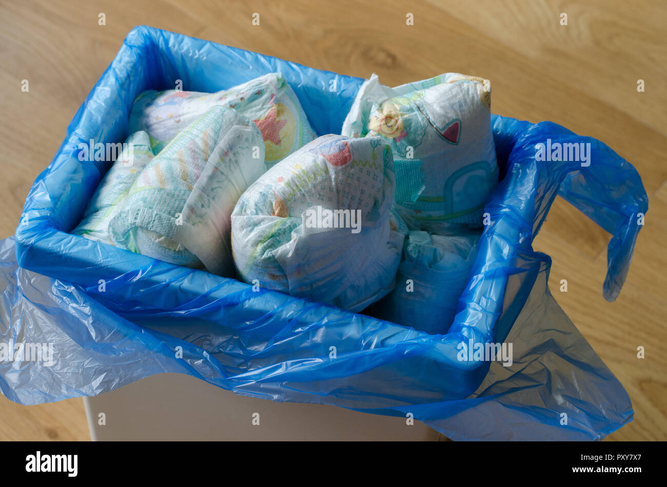 trash bin full of used diapers Stock Photo Alamy