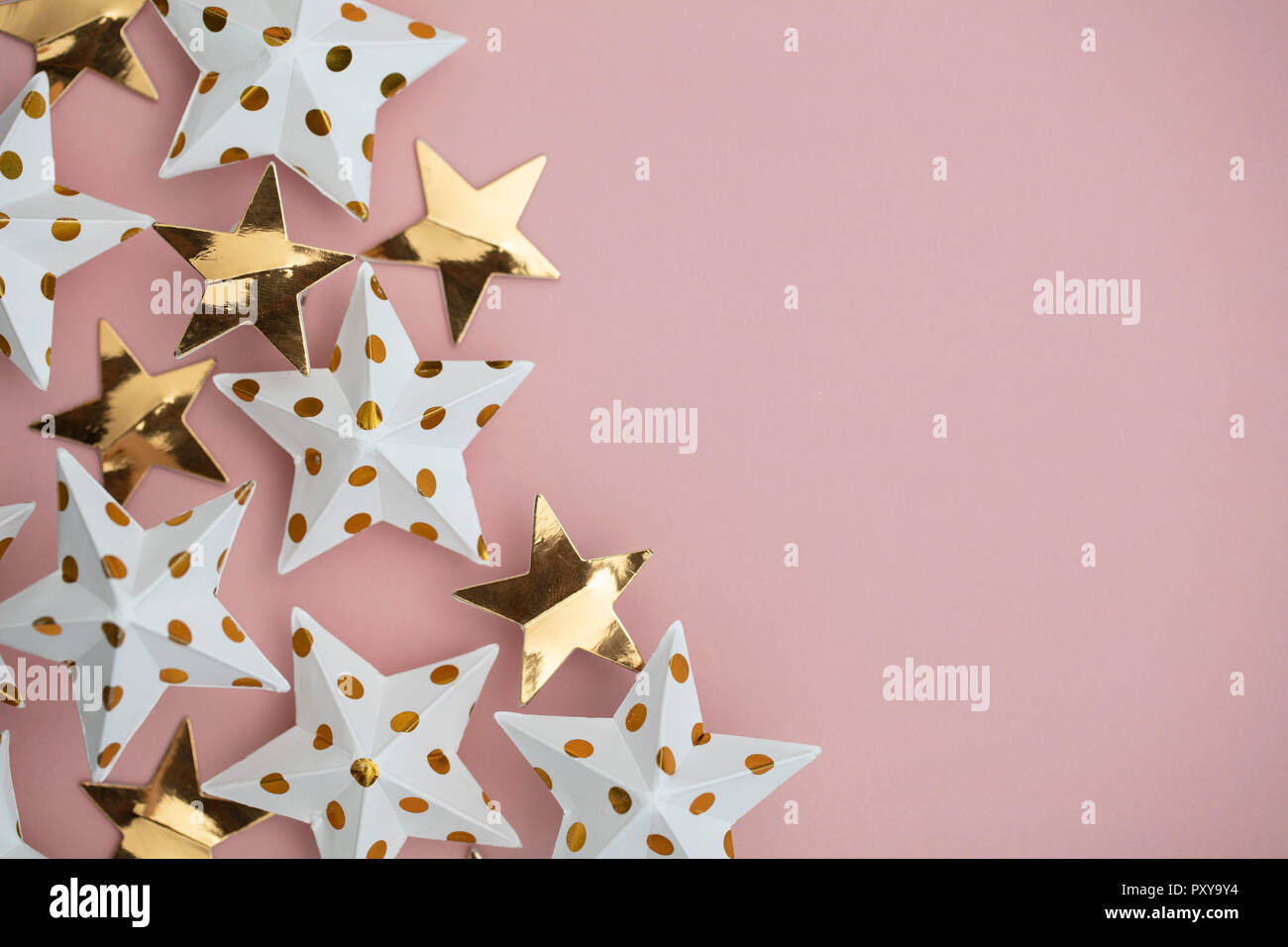 White And Gold Star Decorations On A Pastel Pink Seasonal Festive