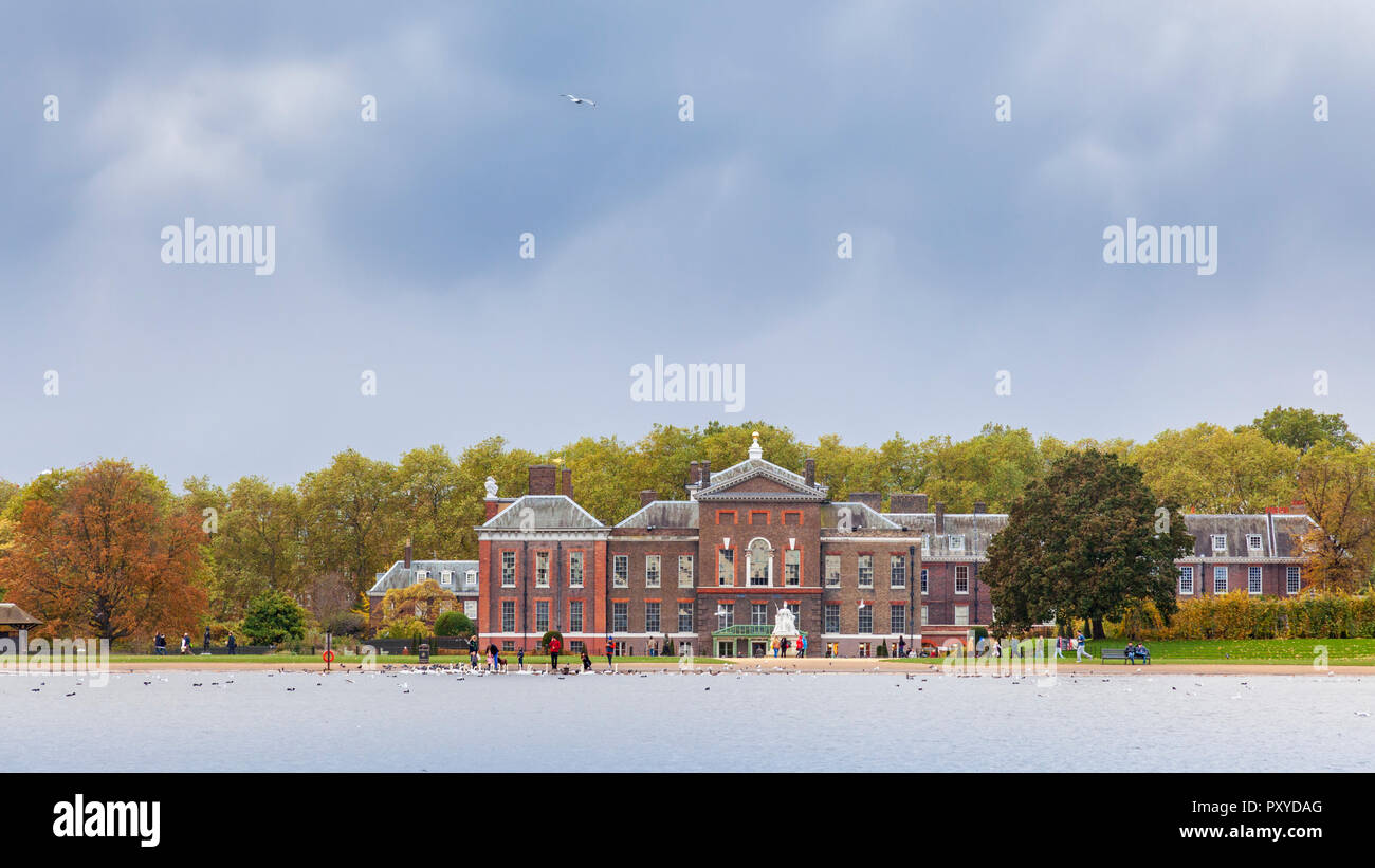 An autumn view of Kensington Palace across the Round Pond in Kensington