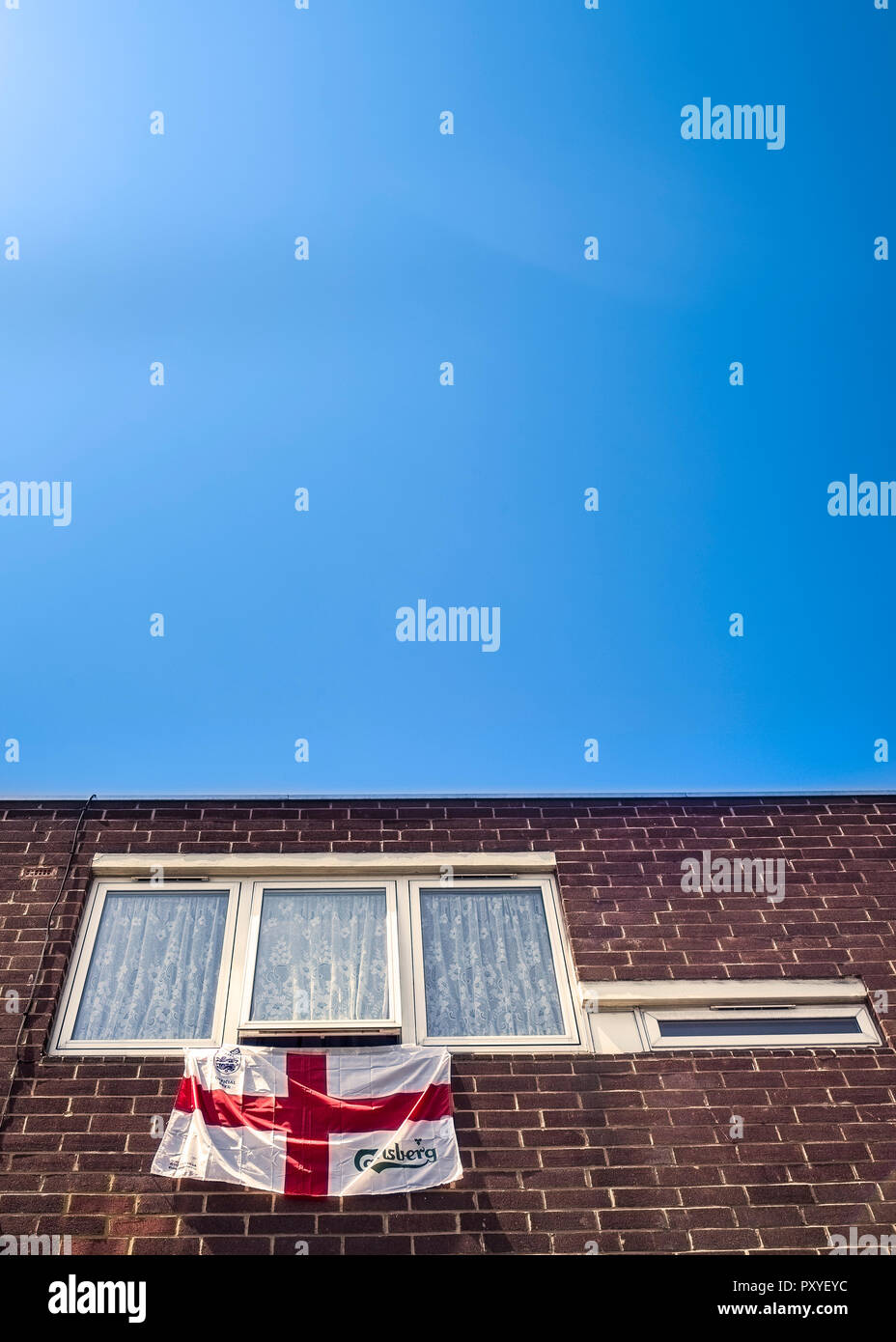 flag of St George hanging from window during football world cup Stock Photo