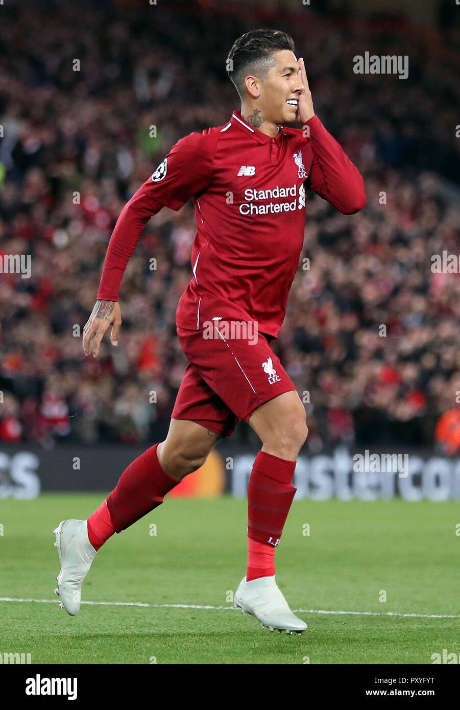 Liverpool's Roberto Firmino celebrates scoring his side's first goal of the  game during the UEFA Champions League, Group C match at Anfield, Liverpool  Stock Photo - Alamy