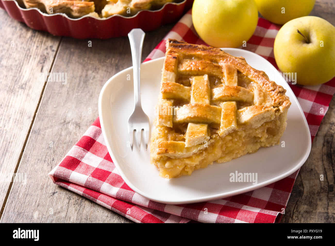 Homemade apple pie slice on wooden table Stock Photo
