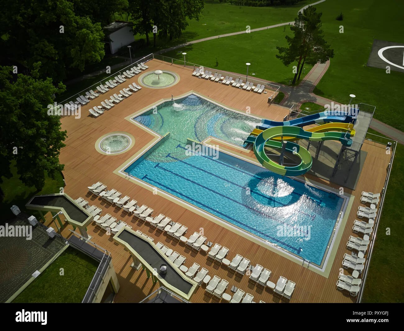 swimming pool on luxury resort in forest Stock Photo - Alamy