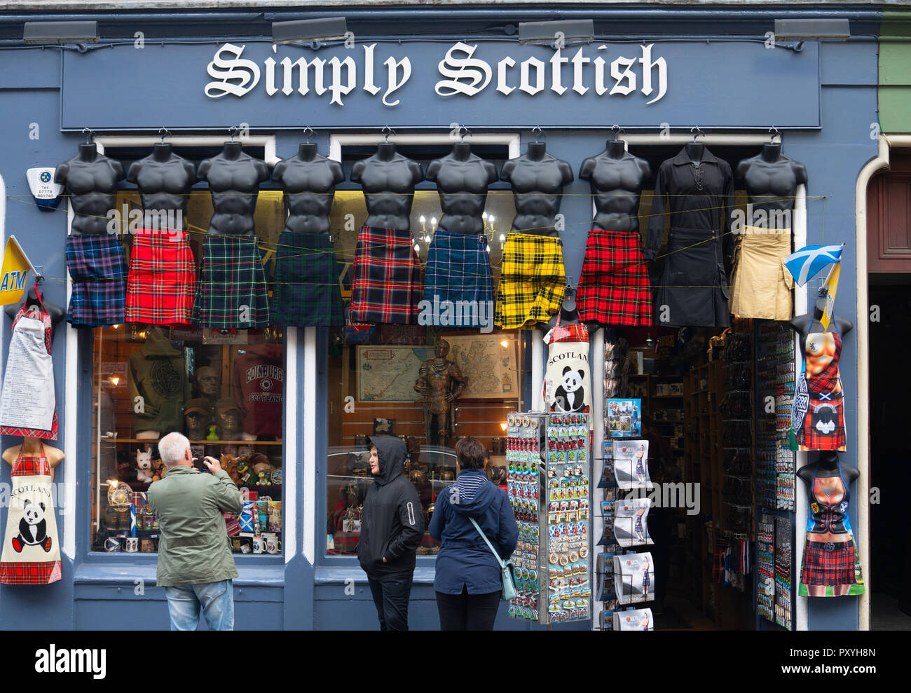 Row of male mannequins wearing kilts outside tourist gift shop on the Royal Mile in Edinburgh, Scotland, UK. Stock Photo