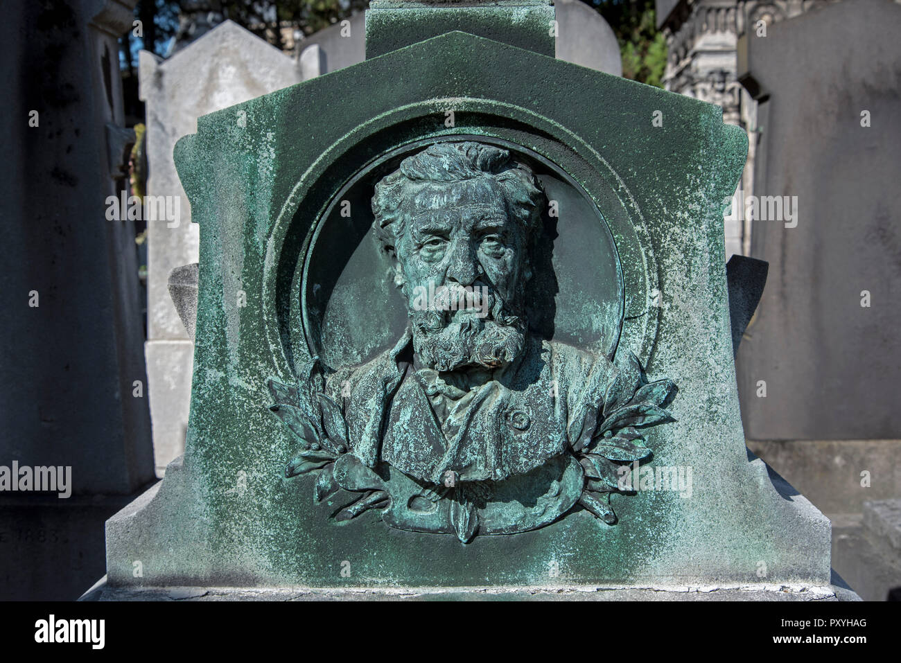 The medallion portrait of the painter Félix-Joseph Barrias (1822-1907) by his brother the sculptor Louis-Ernest Barrias in Passy Cemetery, Paris. Stock Photo