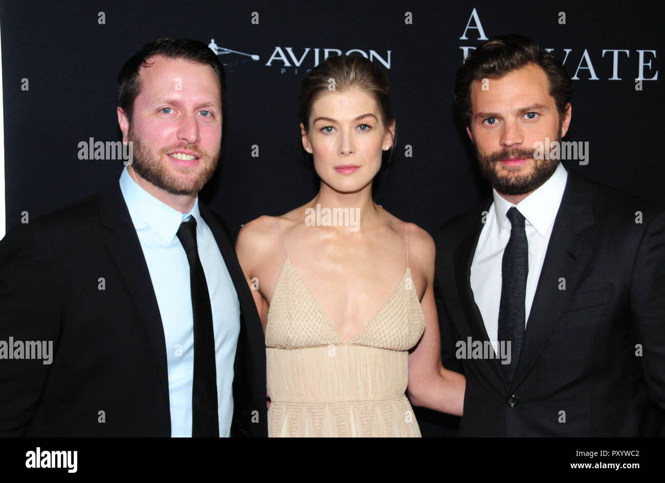 Beverly Hills, California, USA. 24th October, 2018. Director Matthew Heineman, actress Rosamund Pike and actor Jamie Dornan attend the Los Angeles Premiere of Aviron Pictures' 'A Private War' at Samuel Goldwyn Theater in Beverly Hills, California. Photo by Barry King/Alamy Live News Stock Photo