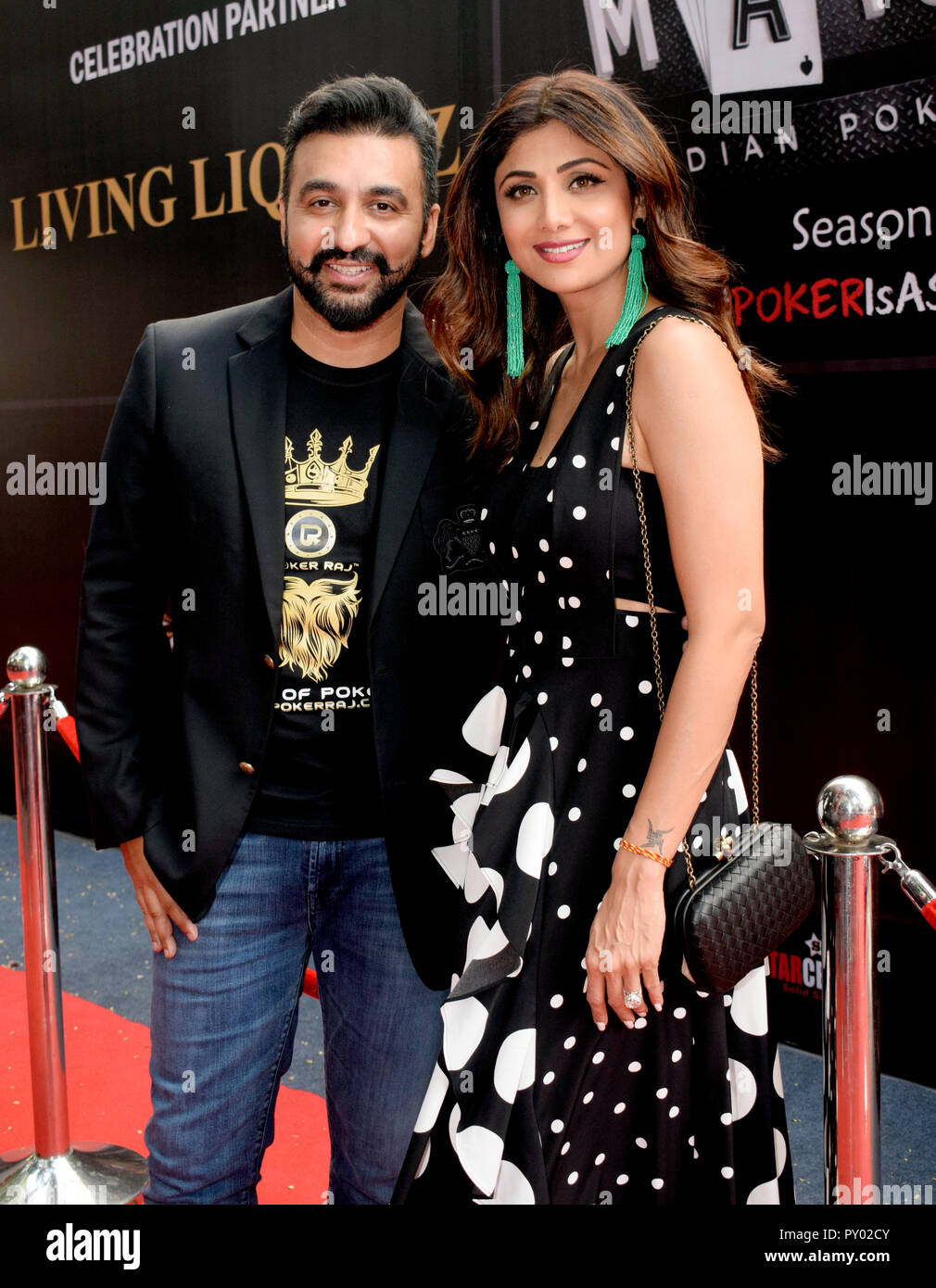 Indian film actress Shilpa Shetty with husband Raj Kundra pose for the photos during the opening ceremony of Indian Poker League season 3 in Mumbai. Stock Photo