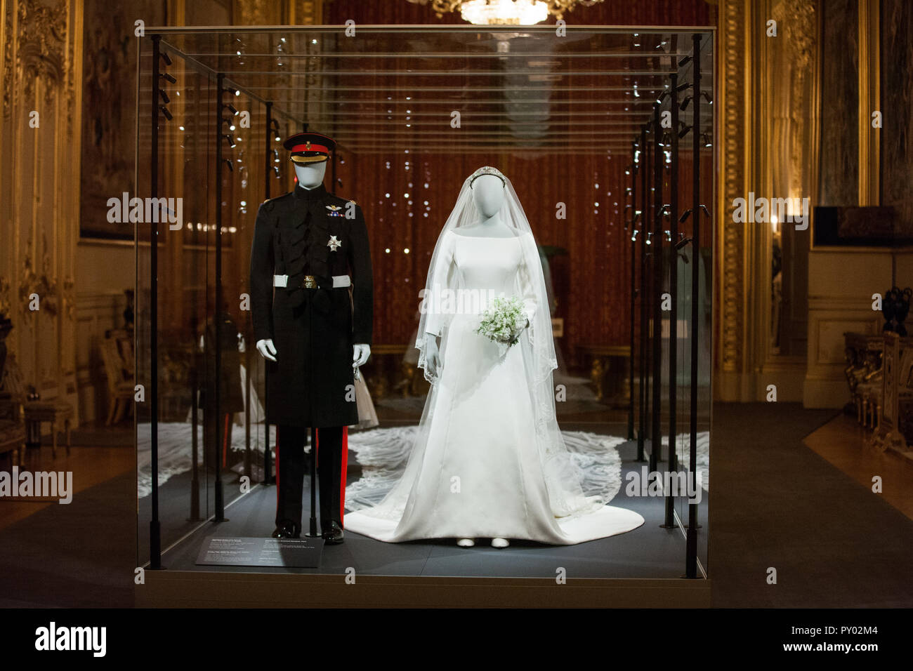 Windsor, UK. 25th October, 2018. IMAGE EMBARGOED FOR PUBLICATION UNTIL 00:01 BST, FRIDAY, 26 OCTOBER. The Duchess of Sussex’s wedding dress, created by the British designer Clare Waight Keller, Artistic Director at the historic French fashion house Givenchy, and the Duke of Sussex's frockcoat uniform of the Household Cavalry will go on display at Windsor Castle from 26th October 2018 to 6th January 2019 as part of a special exhibition entitled 'A Royal Wedding: The Duke and Duchess of Sussex'. Credit: Mark Kerrison/Alamy Live News Stock Photo