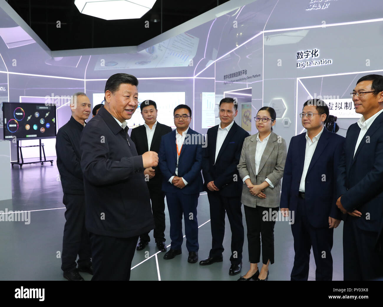 Guangzhou, China's Guangdong Province, during an inspection tour. 24th Oct, 2018. Chinese President Xi Jinping, also general secretary of the Communist Party of China Central Committee and chairman of the Central Military Commission, talks with heads of middle and small-sized private enterprises at an automotive equipment company in Guangzhou, capital of south China's Guangdong Province, during an inspection tour, Oct. 24, 2018. Credit: Xie Huanchi/Xinhua/Alamy Live News Stock Photo