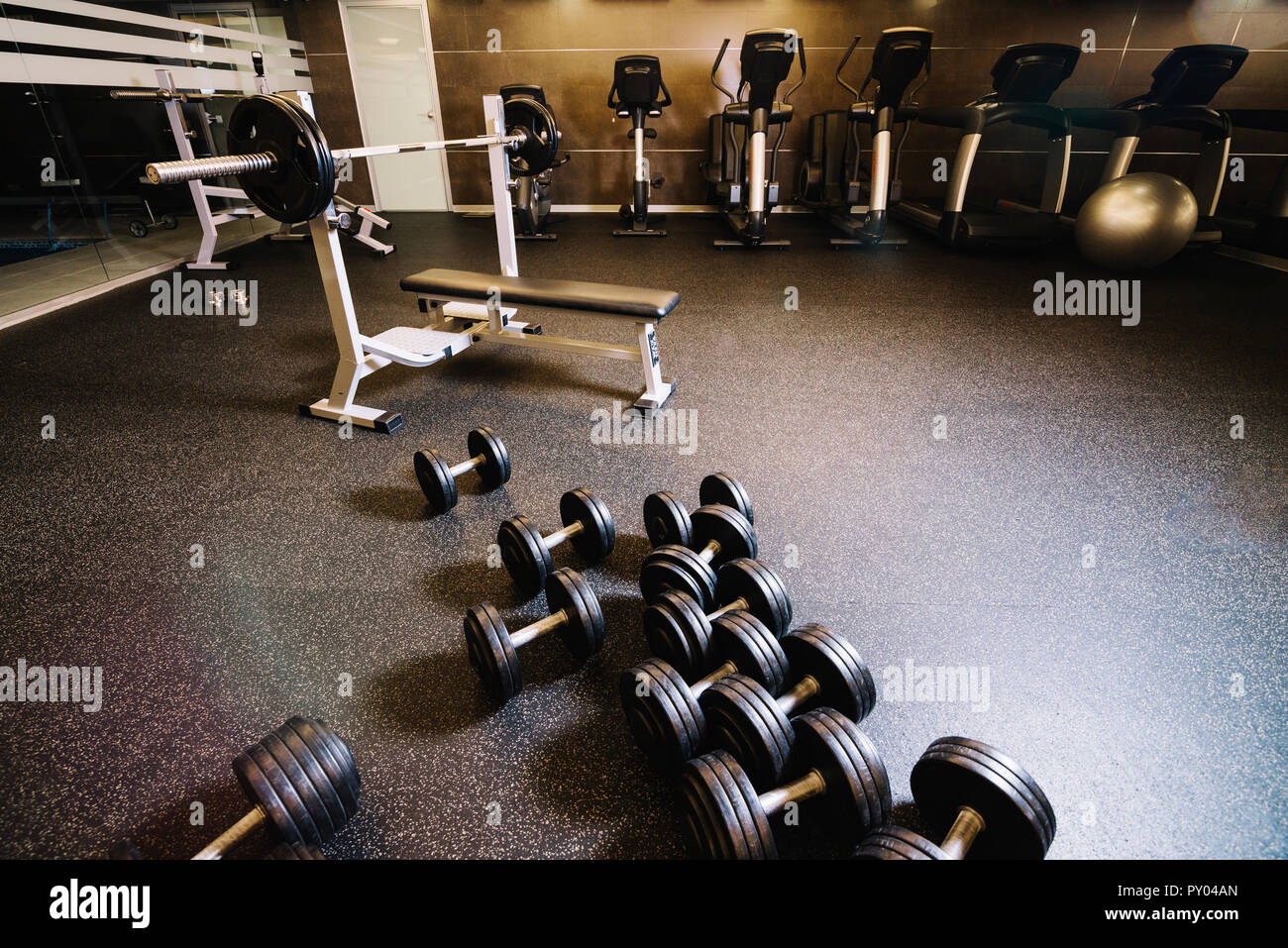 Bunch Of Dumbbells And Bench Press Machine Stock Photo 223123565