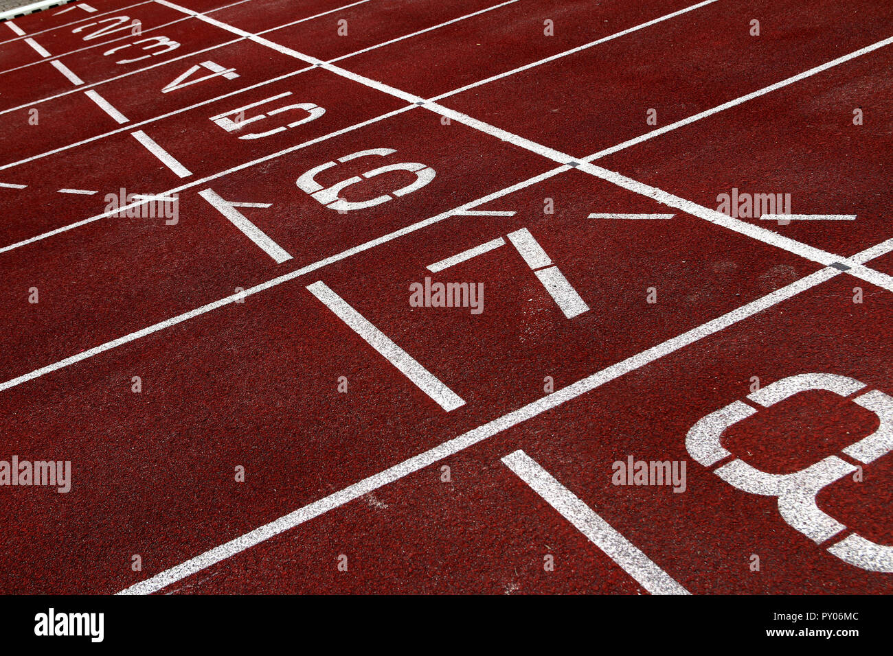 Eight lanes numbered on an athletic track Stock Photo