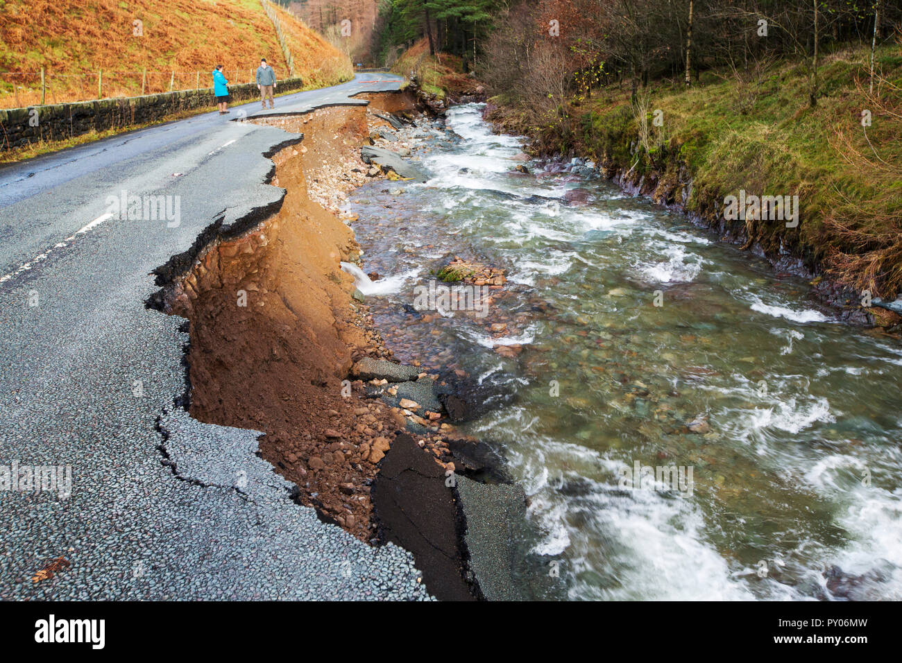 The A591, the main road through the Lake District, completely destroyed by the floods from Storm Desmond, Cumbria, UK. The road was breached in several places by landslides and walls of flood debris twenty feet high. the road will probably be closed for months. Taken on Sunday 6th December 2015. Stock Photo