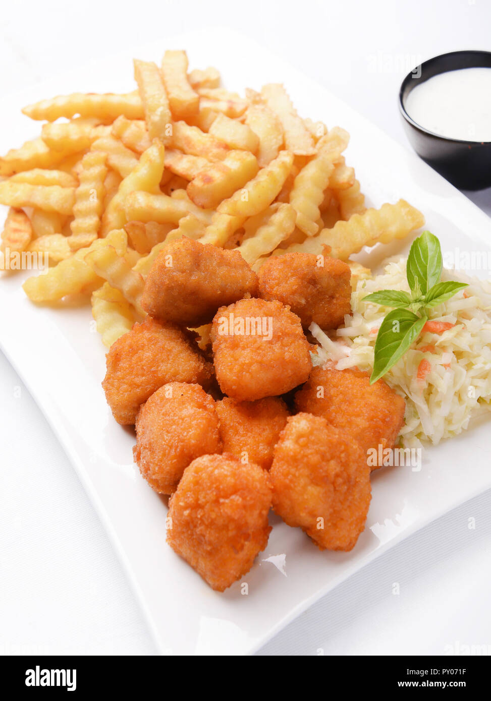 Fries with chicken nuggets and salad Stock Photo Alamy