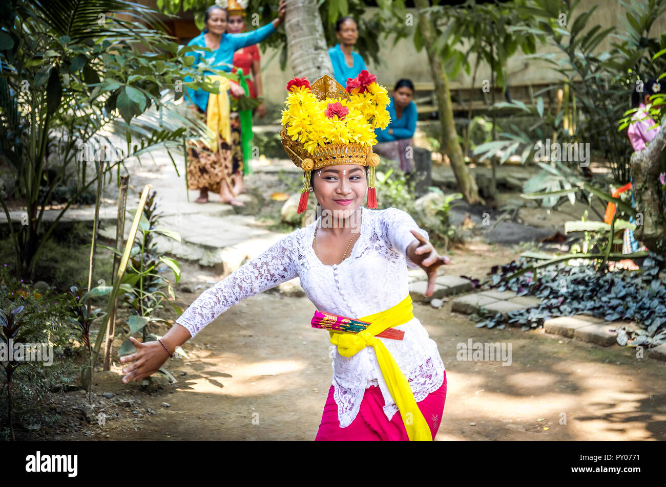 BALI, INDONESIA - APRIL 25, 2018: Balinese dancer wearing beautiful outfit performing on Bali Island, Indonesia Stock Photo