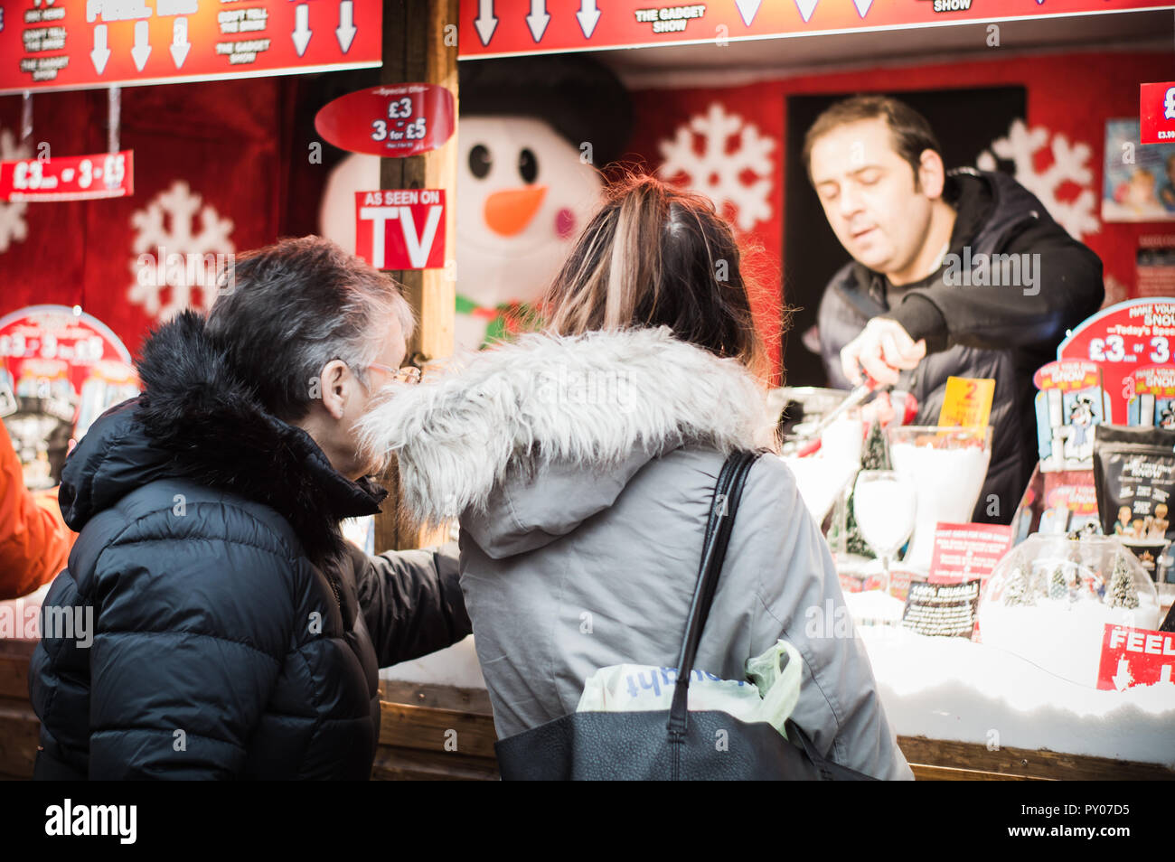 Christmas shoppers at a Xmas market in Glasgow. Stock Photo