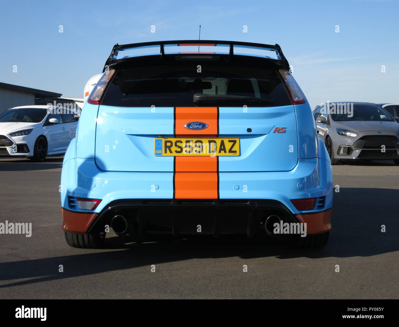 Ford Focus RS mk2 shown at donnington park race circuit at the RS owners club national day - custom paintwork in the style of the GT40 Gulf livery rear view with personalised number plate Stock Photo