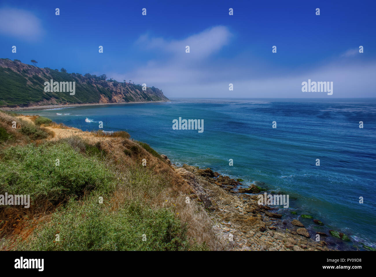 Colorful coastal view of Bluff Cove covered with a marine layer near