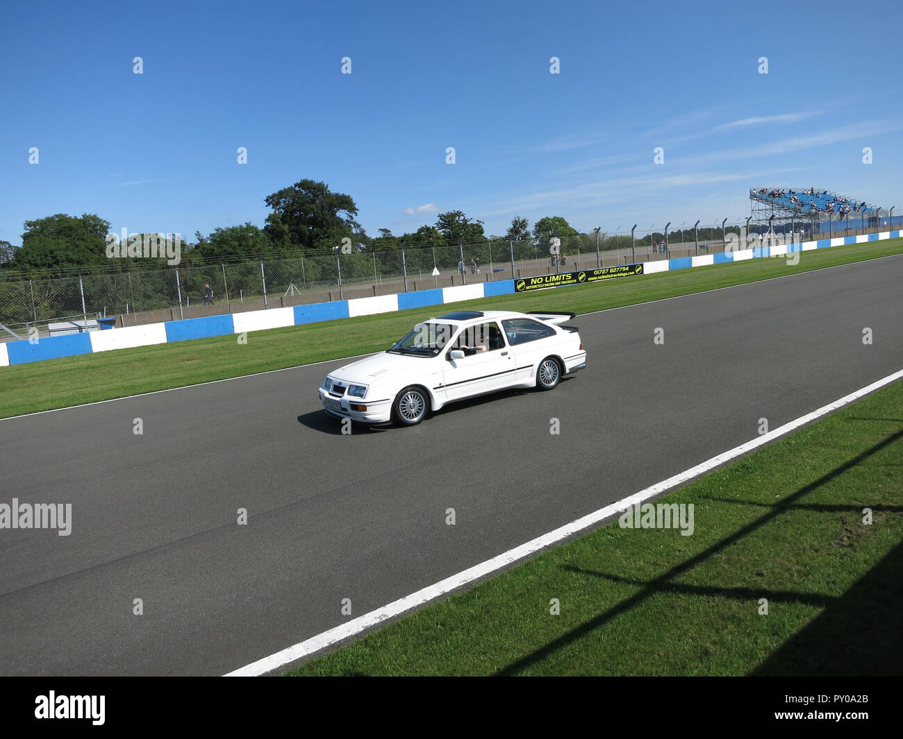 Ford Sierra RS Cosworth in white shown at donnington park race circuit at the RS owners club national day 2017 leading a parade lap mk1 1st generation Stock Photo