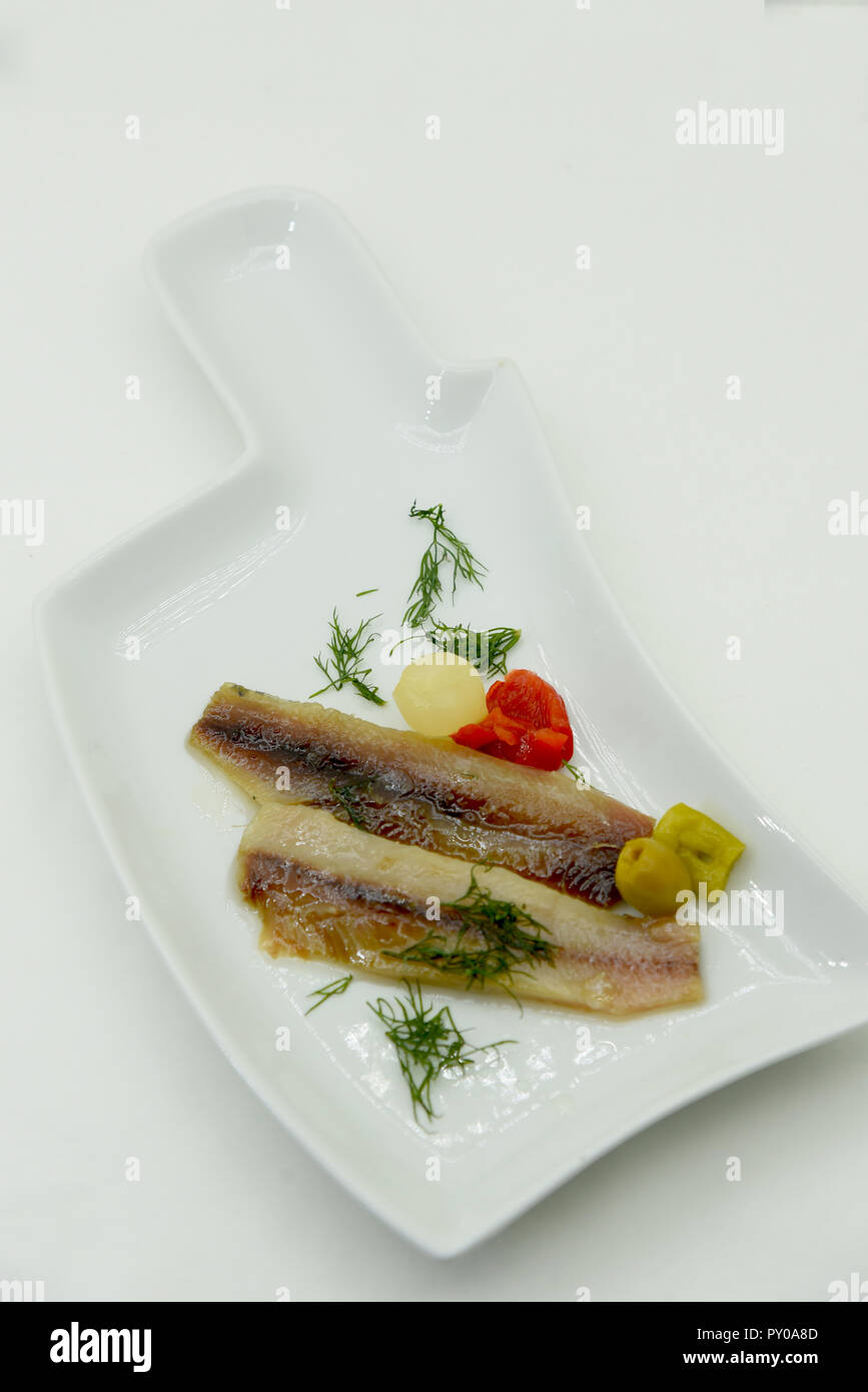 marinated anchovies with olive oil and herb Stock Photo Alamy