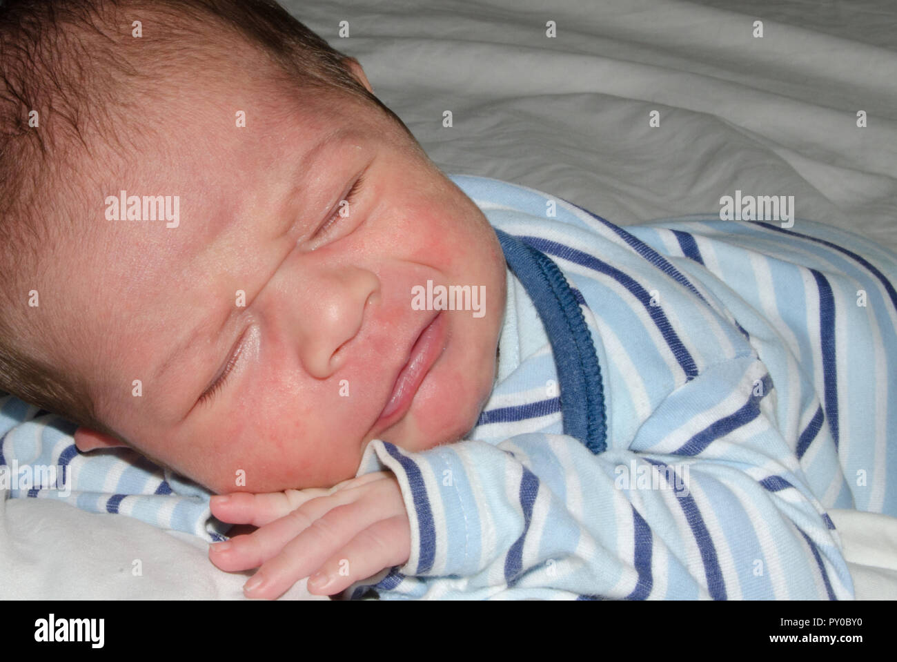 fuzzy baby trying to fall asleep, olmost crying, sad face expresion