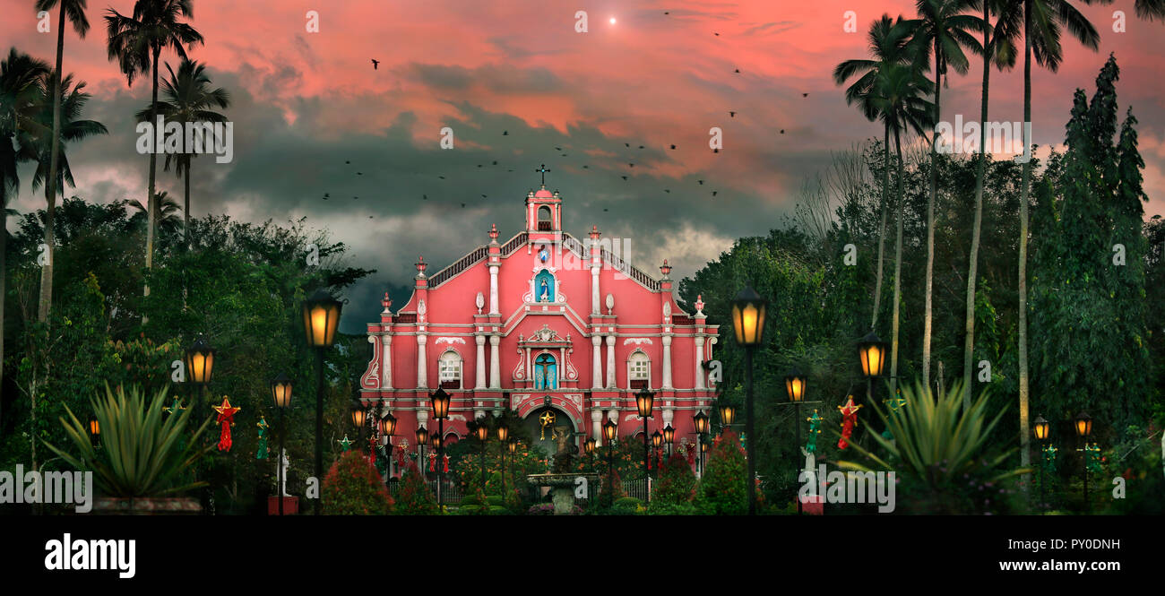 Building exterior of colonial style church among palm trees at Villa Escudero Plantation, Laguna, Luzon Island, Philippines Stock Photo