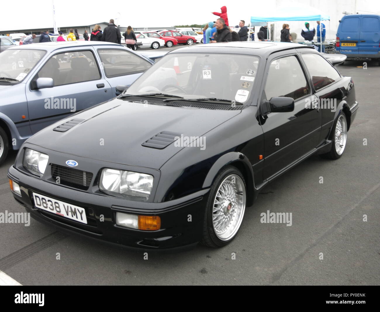 Ford Sierra RS Cosworth in black shown at donnington park race circuit at the RS owners club national day - front view with aftermarket non standard alloy wheels mk1 1st generation Stock Photo