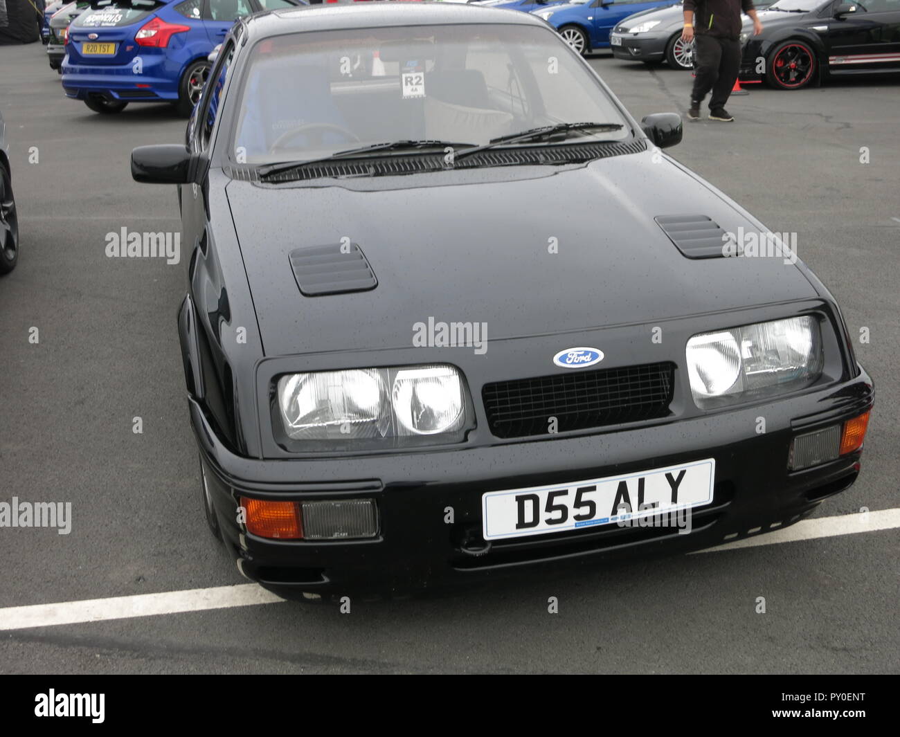 Ford Sierra RS Cosworth in black shown at donnington park race circuit at the RS owners club national day - front view with aftermarket non standard alloy wheels mk1 1st generation Stock Photo