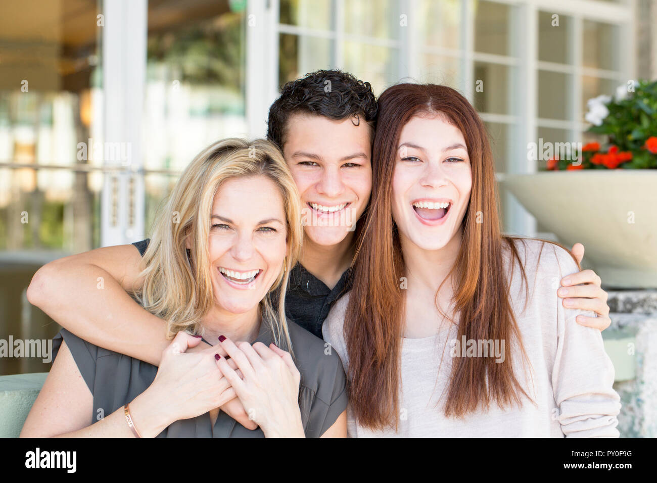 Portrait of a Latin mother and her teenage children. Stock Photo