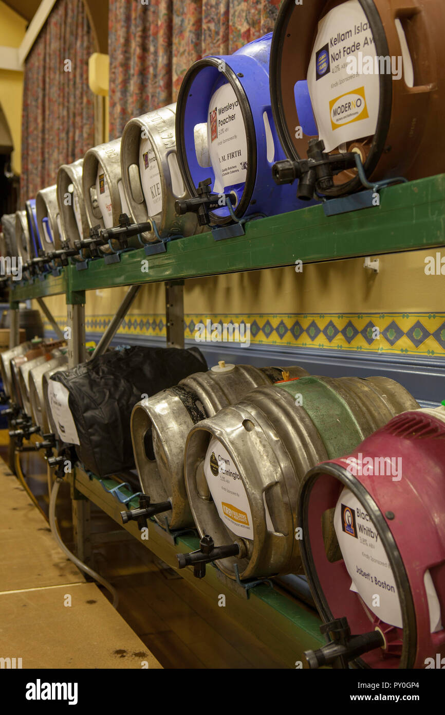Casks of real ale racked in stillages ready for the start of Boston Spa beer festival Stock Photo