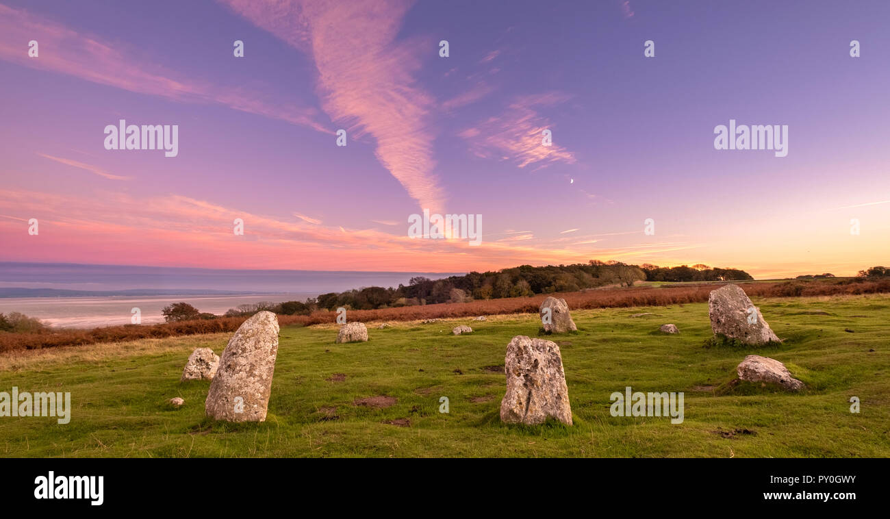 Dusk at the Druid's Circle on Birkrigg Common, a fairly small and unassuming stone circle overlooking Morecambe Bay just outside Ulverston in Cumbria. Stock Photo