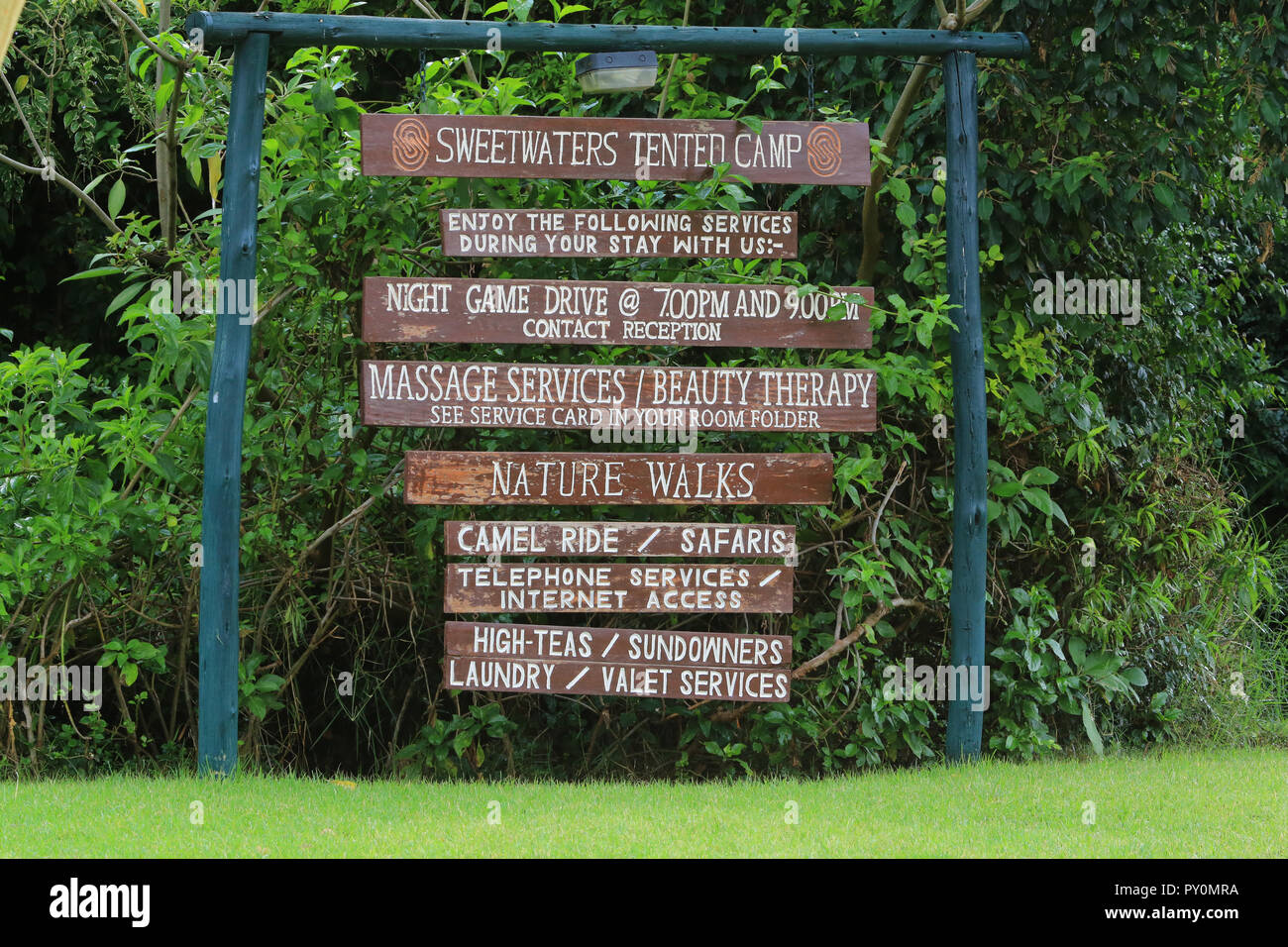 The sign listing available services at Sweetwaters Tented Camp near the Ol Pejeta Conservancy, Laikipia County, Kenya. Stock Photo