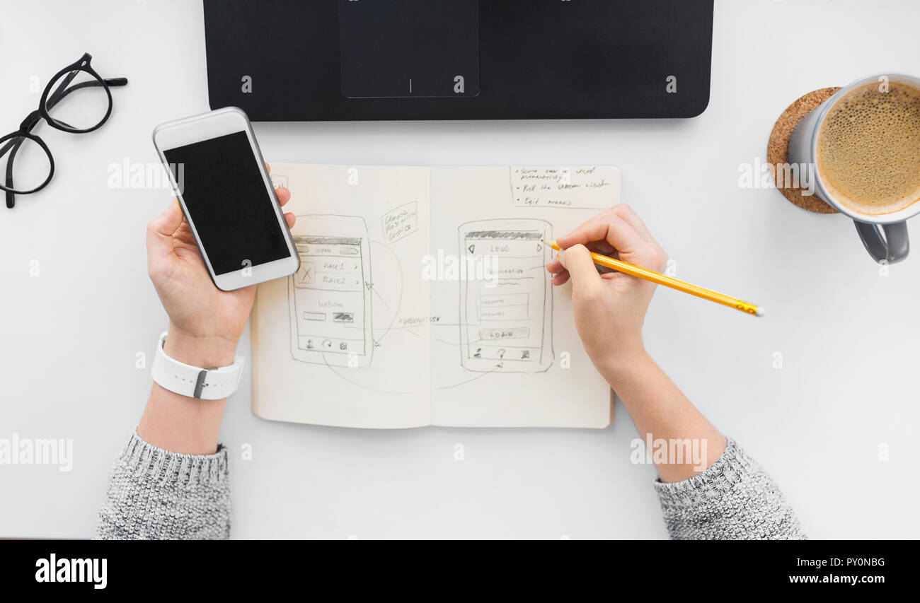 web designer working on smartphone user interface Stock Photo